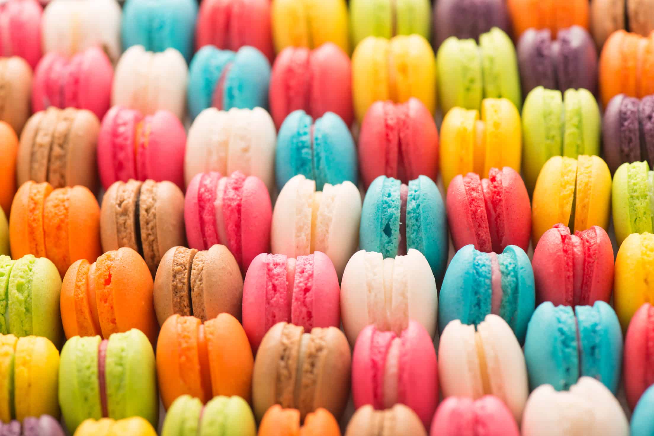 Colourful tasty macaroons in a row Colourful tasty macaroons in a row